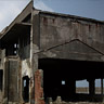 The factory where machines were maintained. It is the two-storied reinforced concrete building and visible from a tourist walking route.