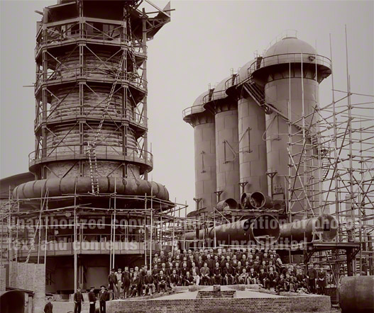 Blast Furnace No. 1 (later renamed Higashida Blast Furnace No. 1). The Imperial Steel Works commenced operations in Feb 1901. This photo was taken in April 1900, ten months before its first blowing in. Hirobumi Ito, the first Prime Minister of Japan, was in front of the furnace. He understood the importance of steel for an industrial nation and when he became the Ｐｒime Minister for his second term, he started to construct the Imperial Steel Works at Yawata.